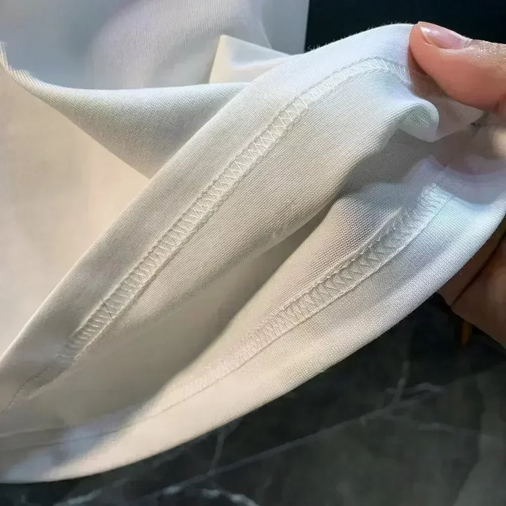 Close-up of the stitching detail on a Pierce The Veil Band T-Shirt - Black Unisex Cotton Crew Neck Tee sleeve.