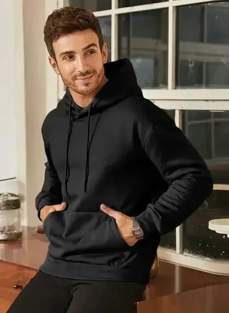 Men's vintage patterned hooded sweatshirt long sleeves drawstring hood sporty autumn pullover worn by a young man.