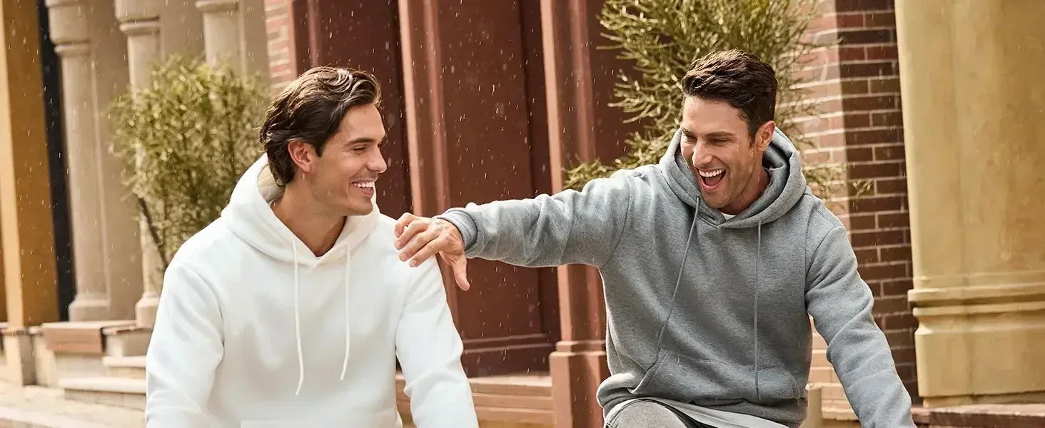 Men's vintage patterned hooded sweatshirt long sleeves drawstring hood sporty autumn pullover worn by two men outdoors.