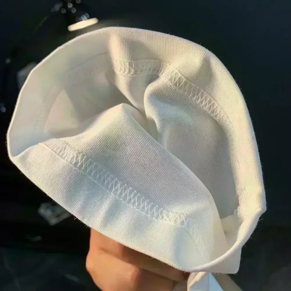 Close-up of the interior fabric of a white cloth, showcasing soft texture and stitching details.